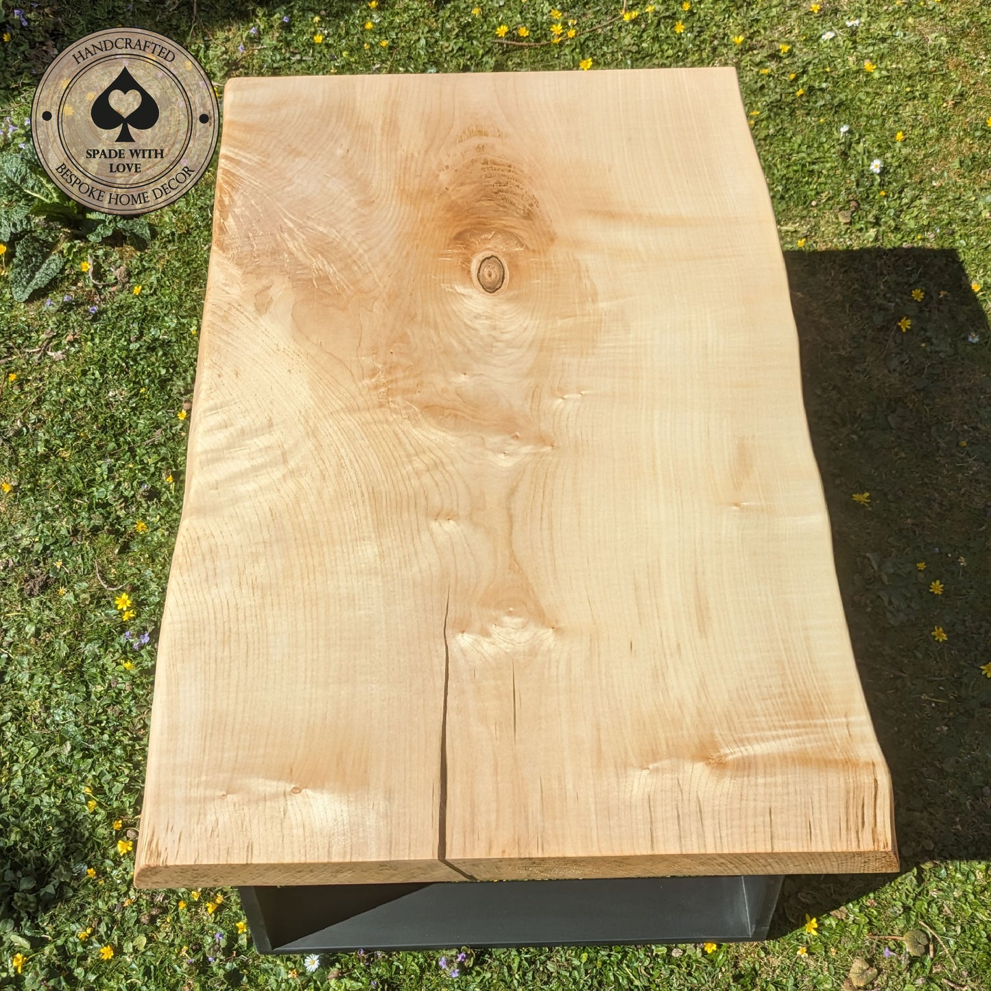 Solid Sycamore Coffee Table with Resin Infill Mounted on black metal legs