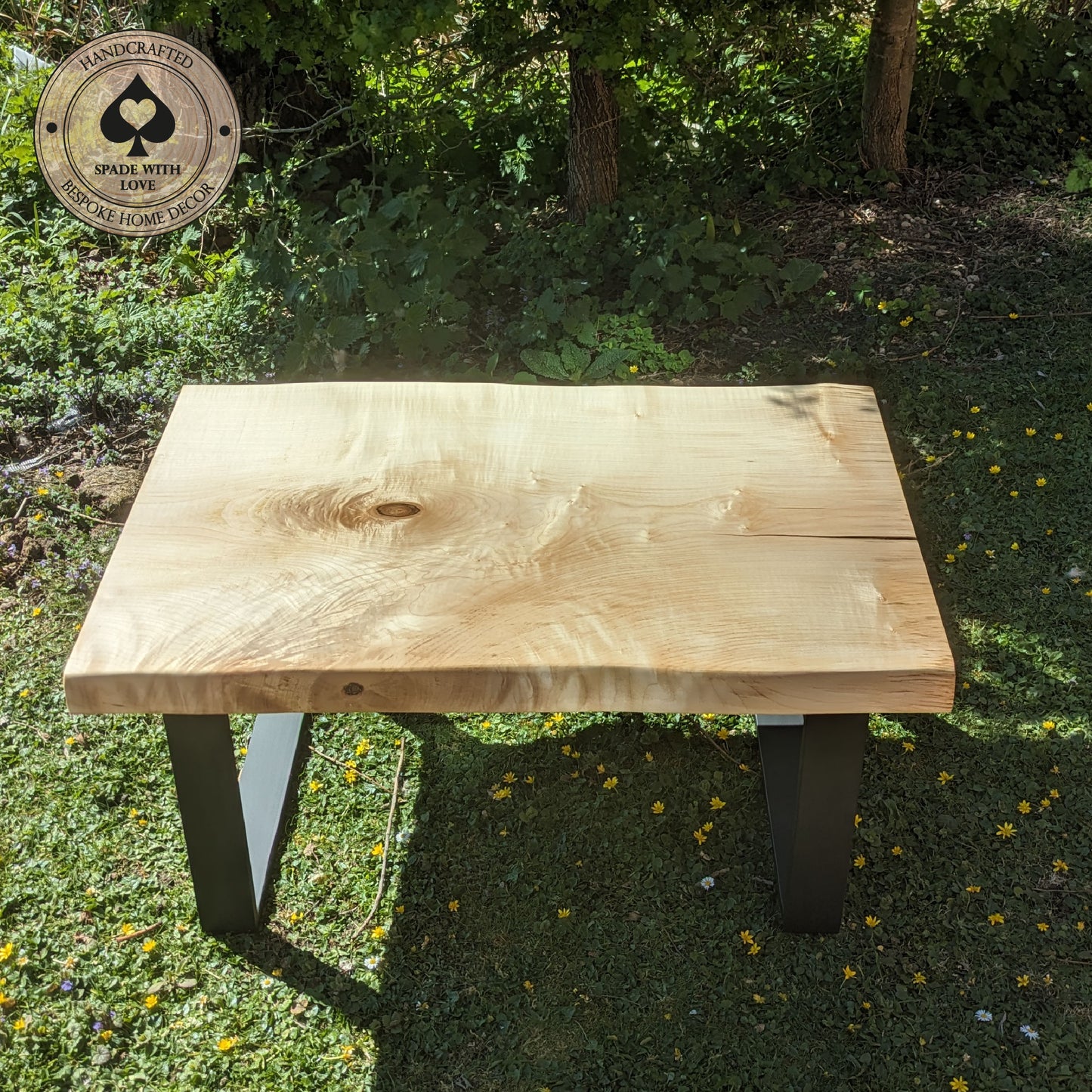 Solid Sycamore Coffee Table with Resin Infill Mounted on black metal legs